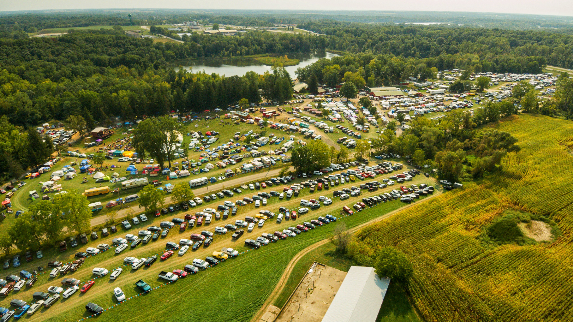 Aerial view of Buck Lake Ranch packed with campers, tents and vendor rows